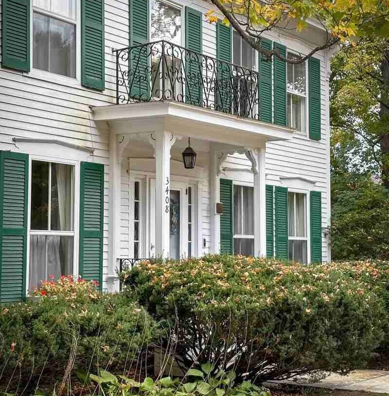 Cream Siding and Forest Green Shutters
