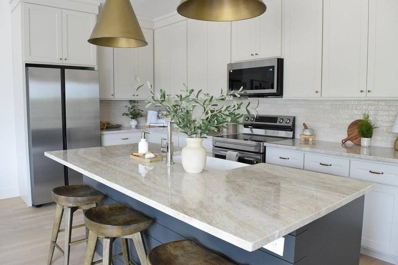 Taj Mahal countertops with white cabinets